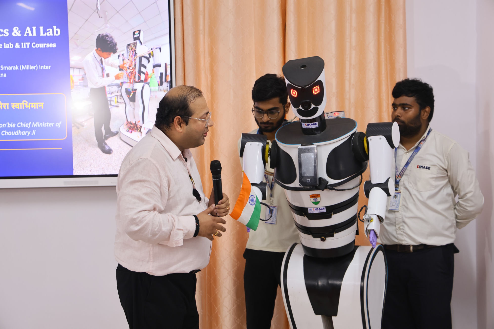 CIMAGE humanoid robot with students and Dr. Neeraj Agrawal at Miller School