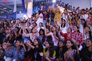 A packed student audience with hands raised during the live concert at CIMAGE Weekend Fest 2026, CIMAGE Campus, Patna.
