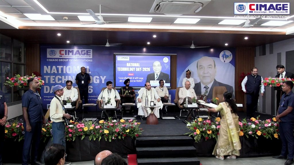 Wide stage view of dignitaries and faculty members seated during the National Technology Day-2026 event at CIMAGE.